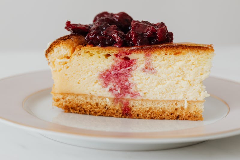 New York Style Cheesecake slice with berry topping